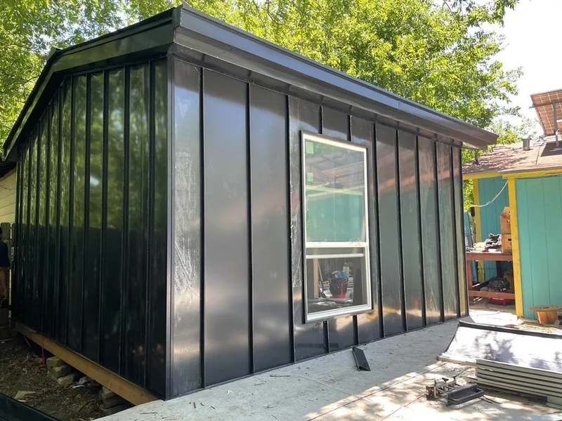 Black standing seam metal wall panels for Metal Roof Installation in Olney